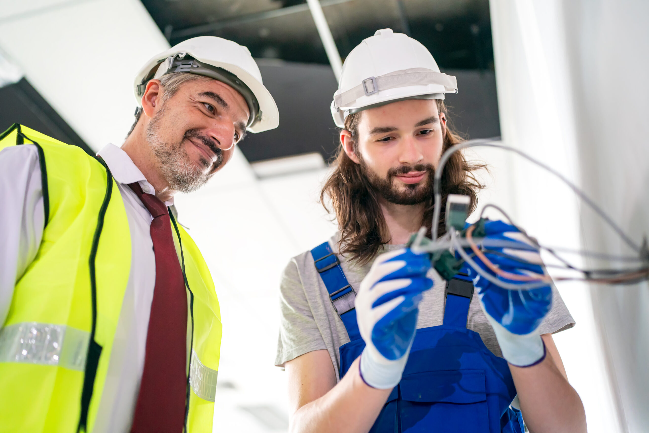 CPR and LVR Course in Brisbane - two men working on wiring in a building 2026 01 07 07 01 05 utc
