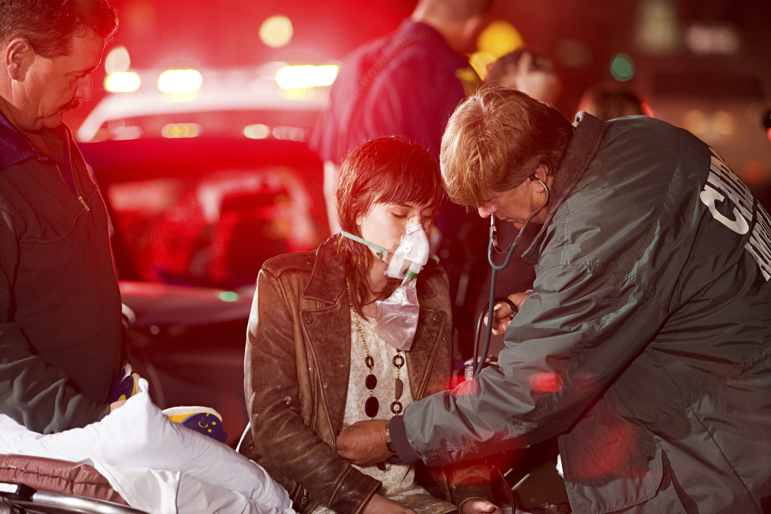 woman receives medical attention on a stretcher at mass casualty event